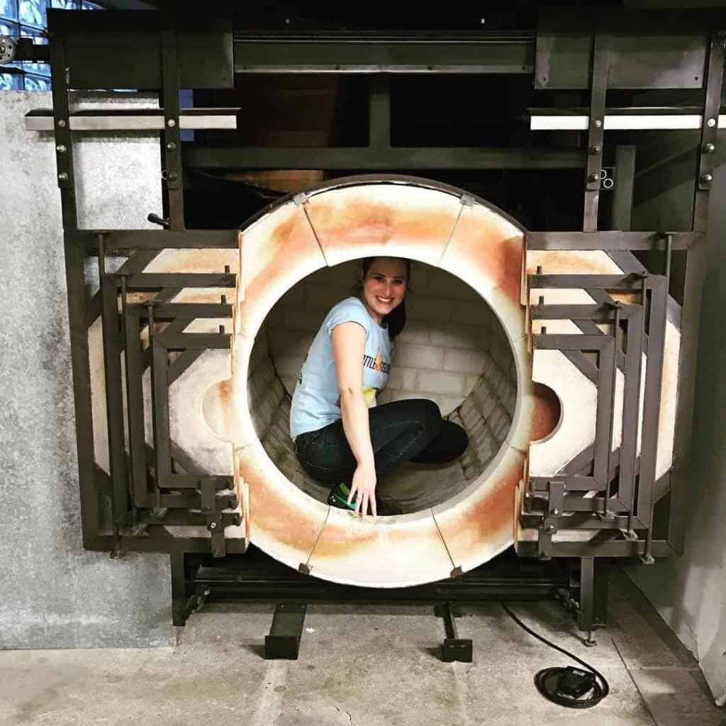 Becca in large reheating chamber