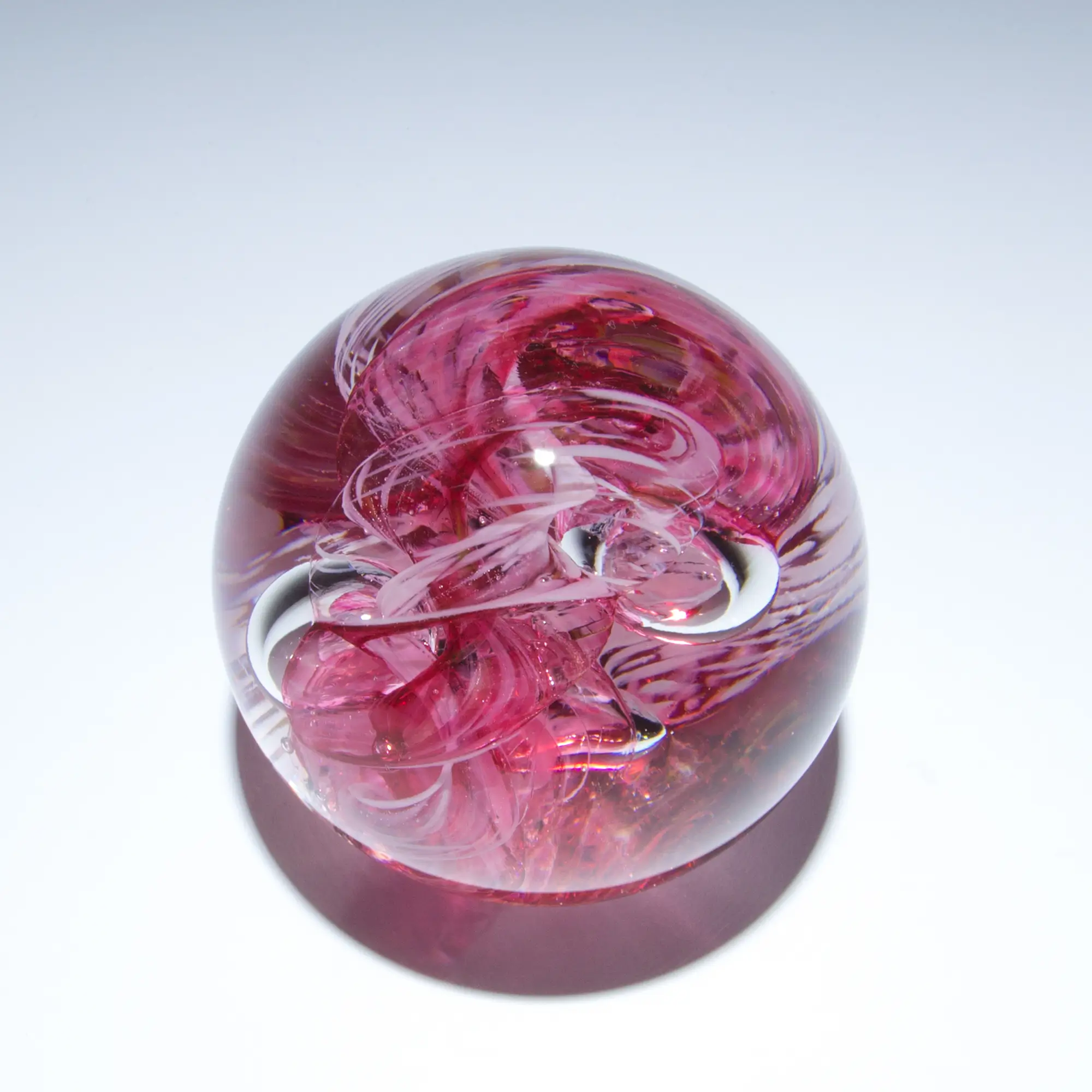 red glass circle paperweight